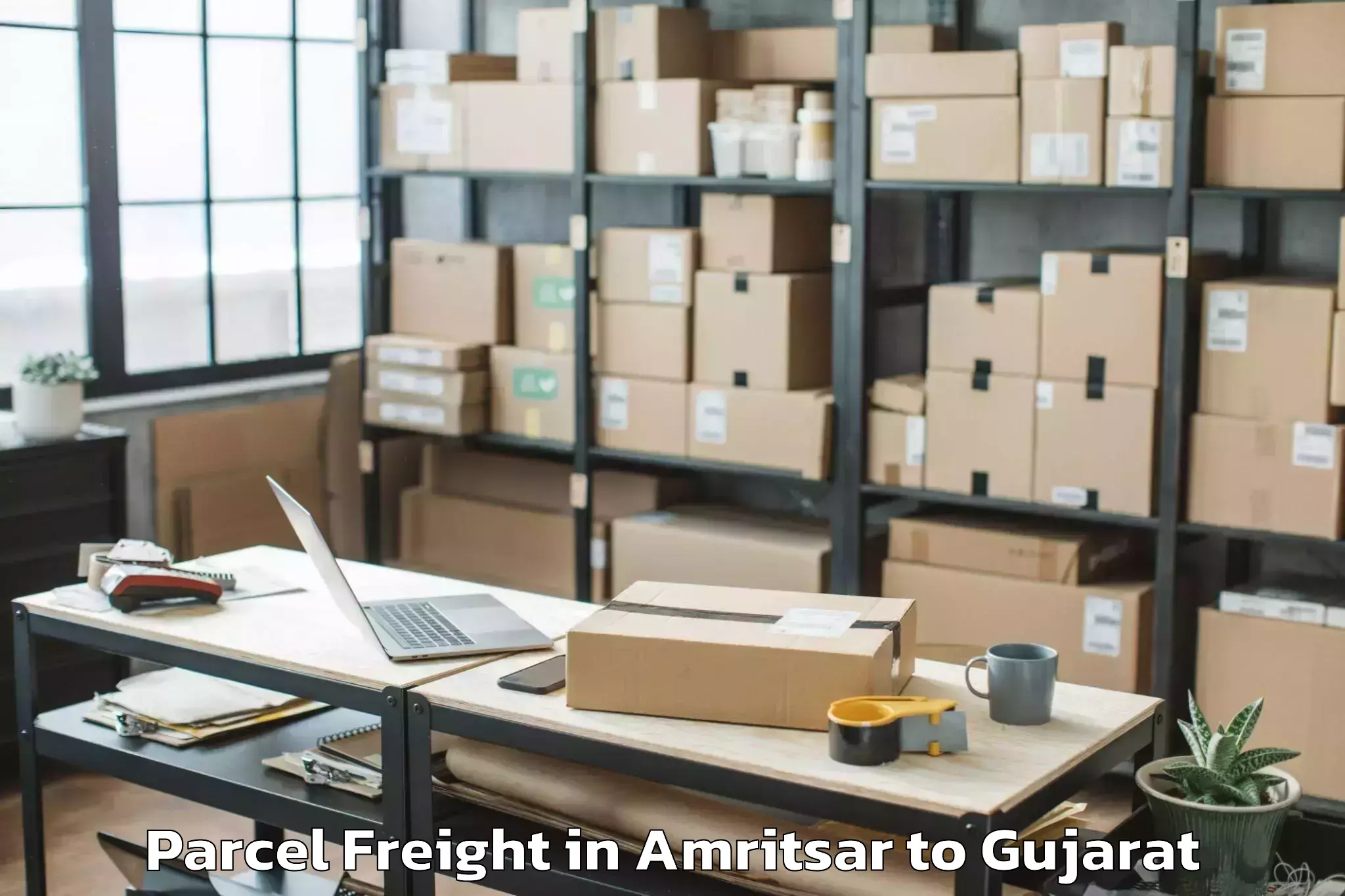 Easy Amritsar to Girgadhada Parcel Freight Booking